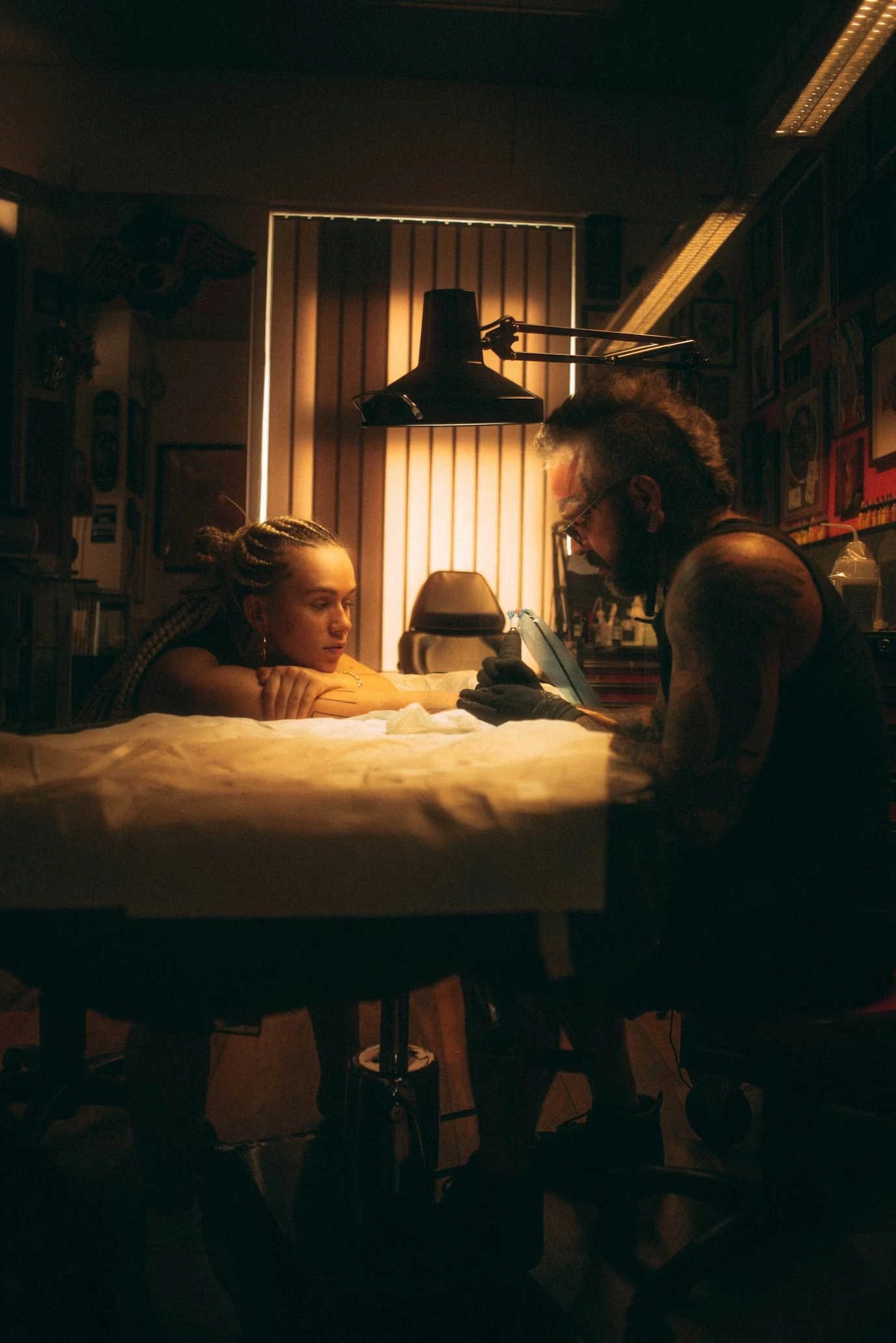 Tattoo artist KAI working in studio